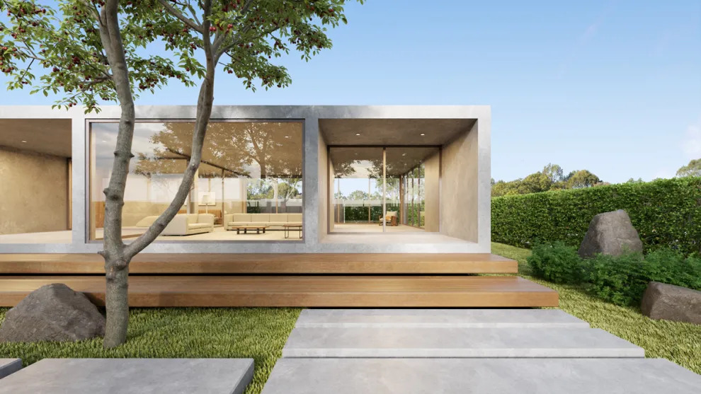 Modern architectural house with concrete pavement in foreground.